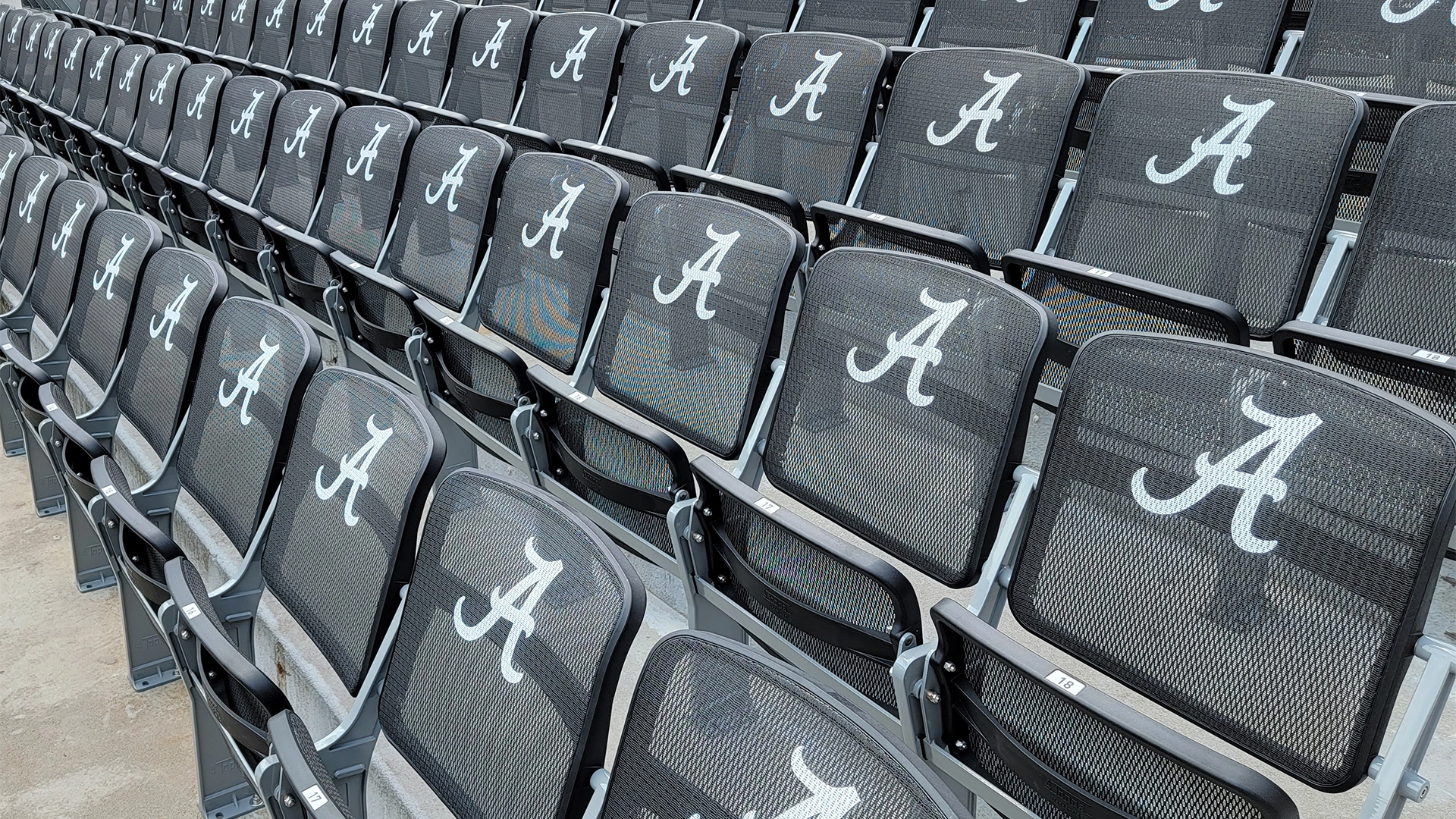upclose shot of custom branded 4topps mesh row seating for university of Alabama